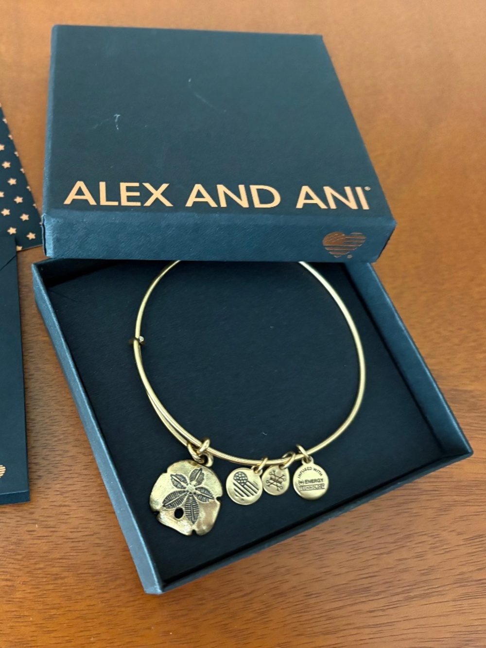 ALEX AND ANI SAND DOLLAR EXPANDABLE CHARM BRACELET BANGLE